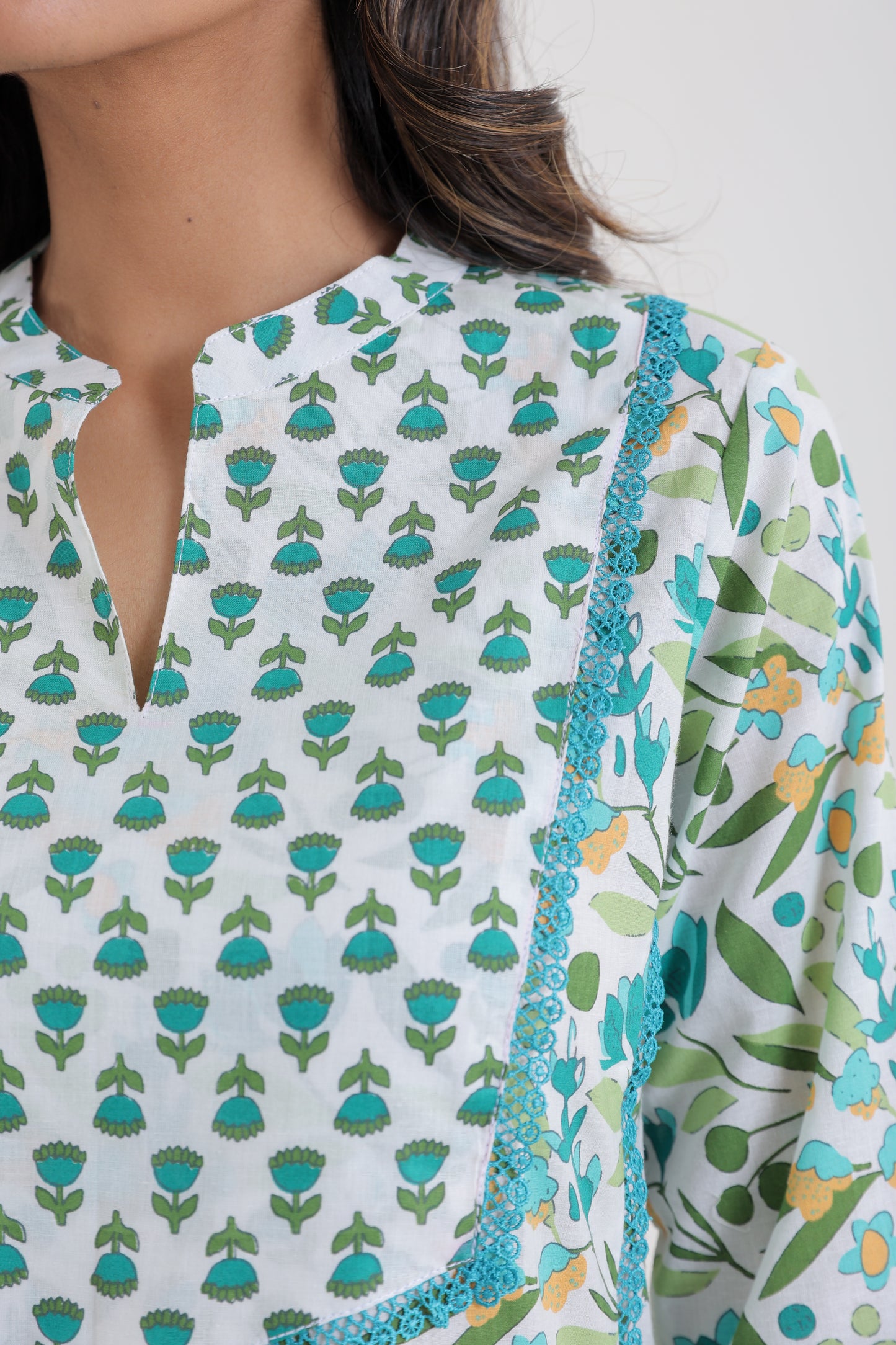 COTTON LEAF FLORAL MOTIFS WITH LACE YOKE KURTA SET IN WHITE AND SEA GREEN